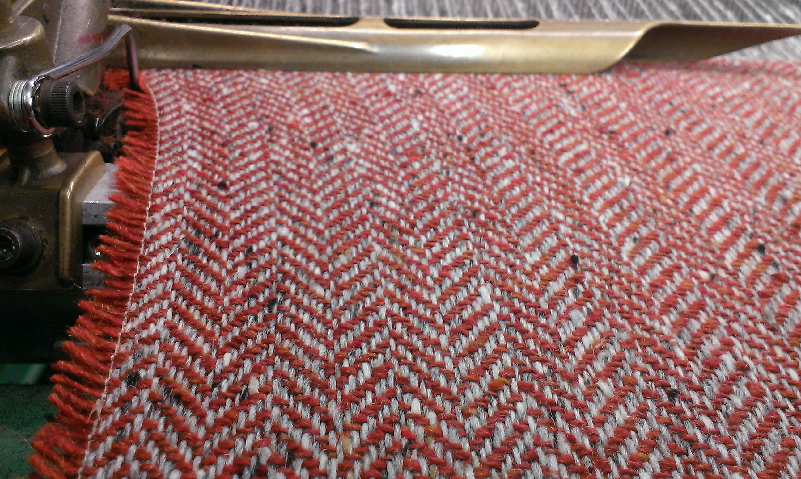 Burnt orange Donegal Tweed freshly woven on a traditional loom